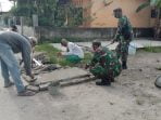 Satgas TMMD 109 Kodim 0201/BS Turut Perbaiki Penutup Saluran Air dan Jalan yang rusak